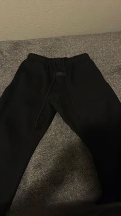 Black essentials pants uncuffed
