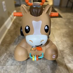 Fisher-Price Walk Bounce & Ride Pony Baby Walker and Ride-on Learning Toy with Music and Lights.