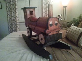 Antique hand carved all wood child's rocker or a great decorator's peice