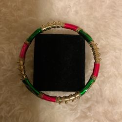Solid Goldtone Bangle Bracelet With Metallic Pink And Green