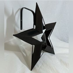 Rustic 12” wide metal star/candle holder with glass votive. For wall mounting. 
