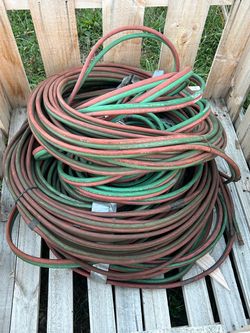 1/4 in torch hose with fitting 50 and 100ft I believe