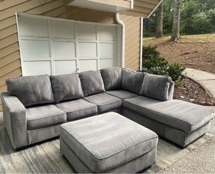 Gray 2pc Ashley Furniture Sectional and ottoman