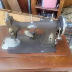 Vintage sewing machine and cabinet