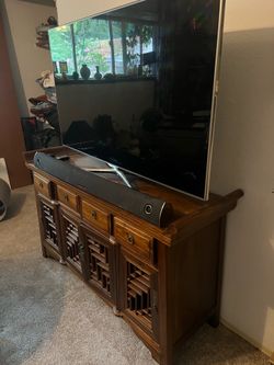 Dark wood sideboard media console  with detailed doors