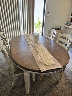 Dining table with chairs and matching cabinet storage
