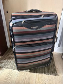 Large striped suitcase luggage