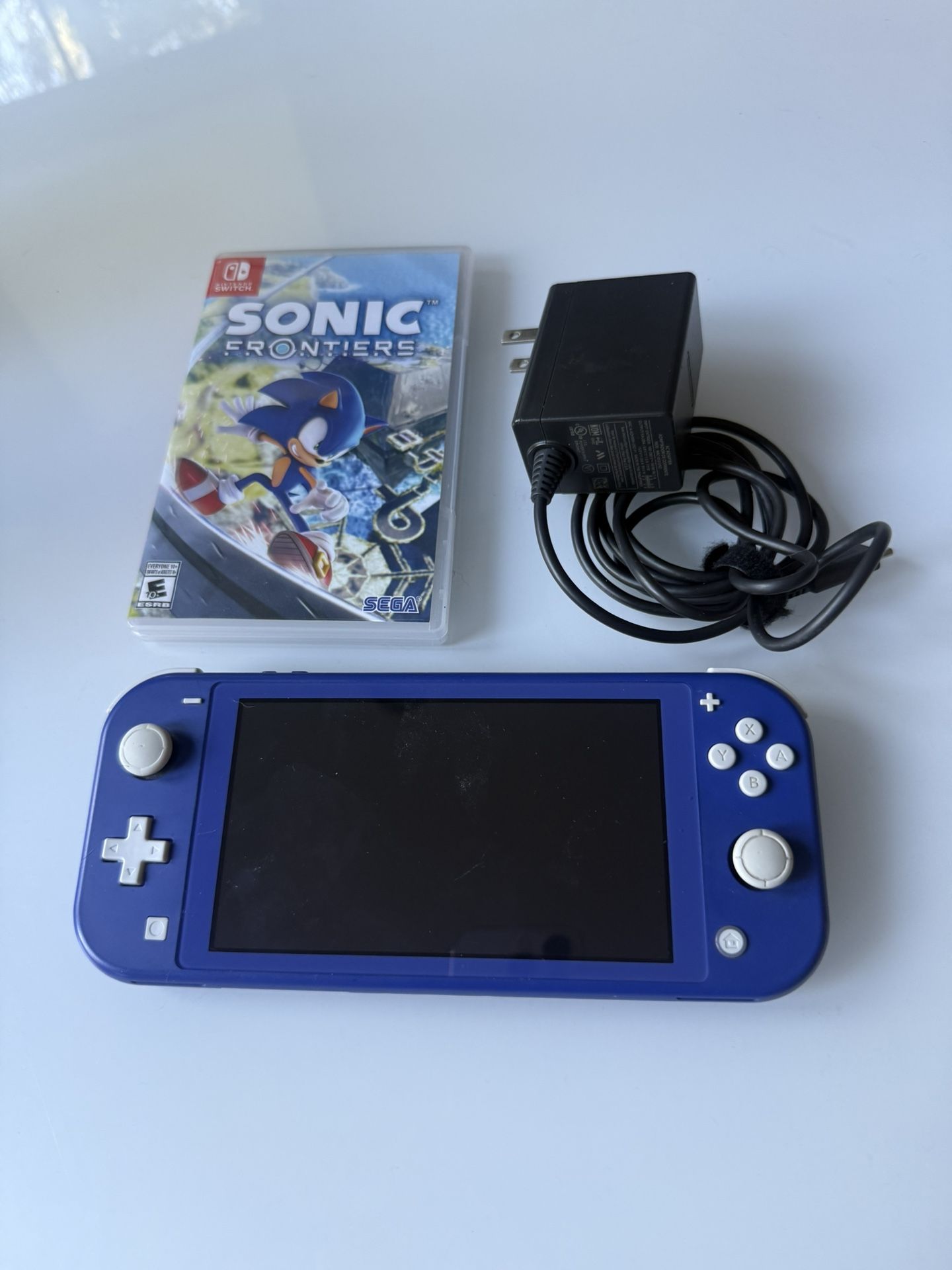 nintendo switch lite, with sonic game and charger. 
