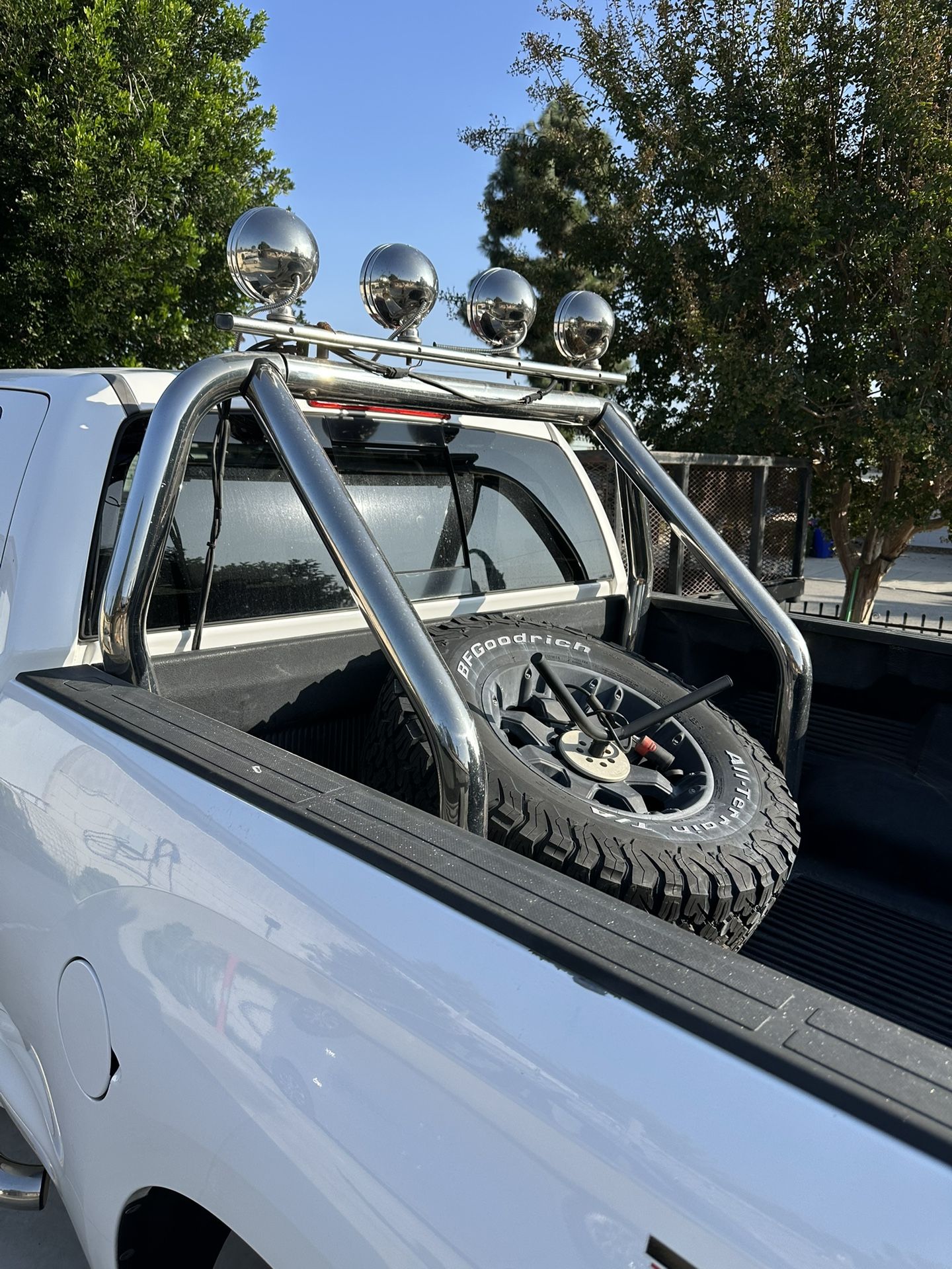 Chrome roll bar with 4 lights. $130 Fits full size truck Spare tire Mount. $100. take both only $200.