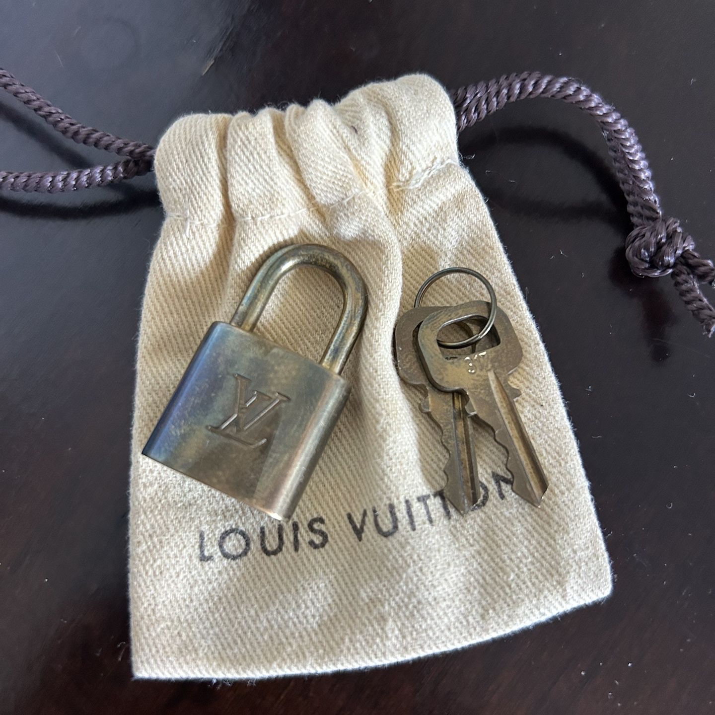 authentic louis vuitton lock # 435 & key for Sale in Buena Park, CA -  OfferUp