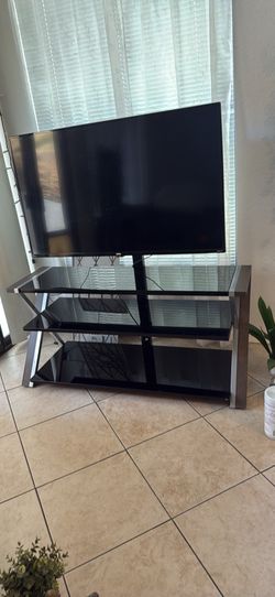 Modern glass TV stand with built-in mount