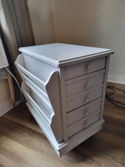 Side table with drawer and paper rack