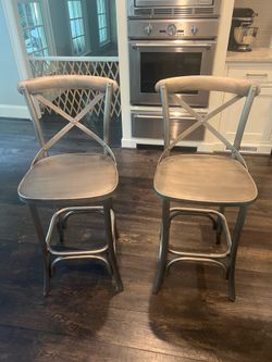 Two metal bar stools