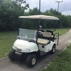 White 2008 GAS Ezgo rxv 4 passenger flip seat golf cart extended canopy lights