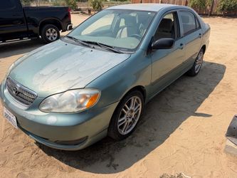 Toyota Corolla Sedan – Light Blue/Green