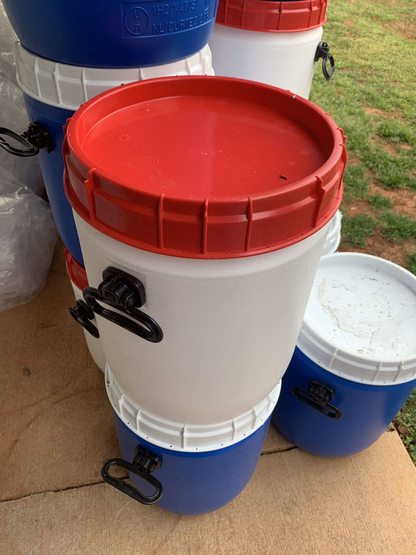 10 gallon containers/ barrels with screw top and handles. Coolers