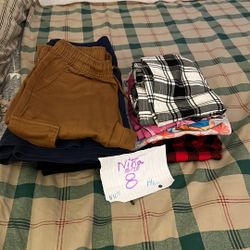 Girls' clothing. Size 8. 14 pieces. (Skirts, pants, pajamas, nightgown, dress)