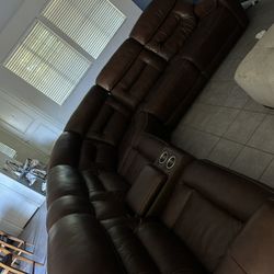 Large brown leather sectional couch
