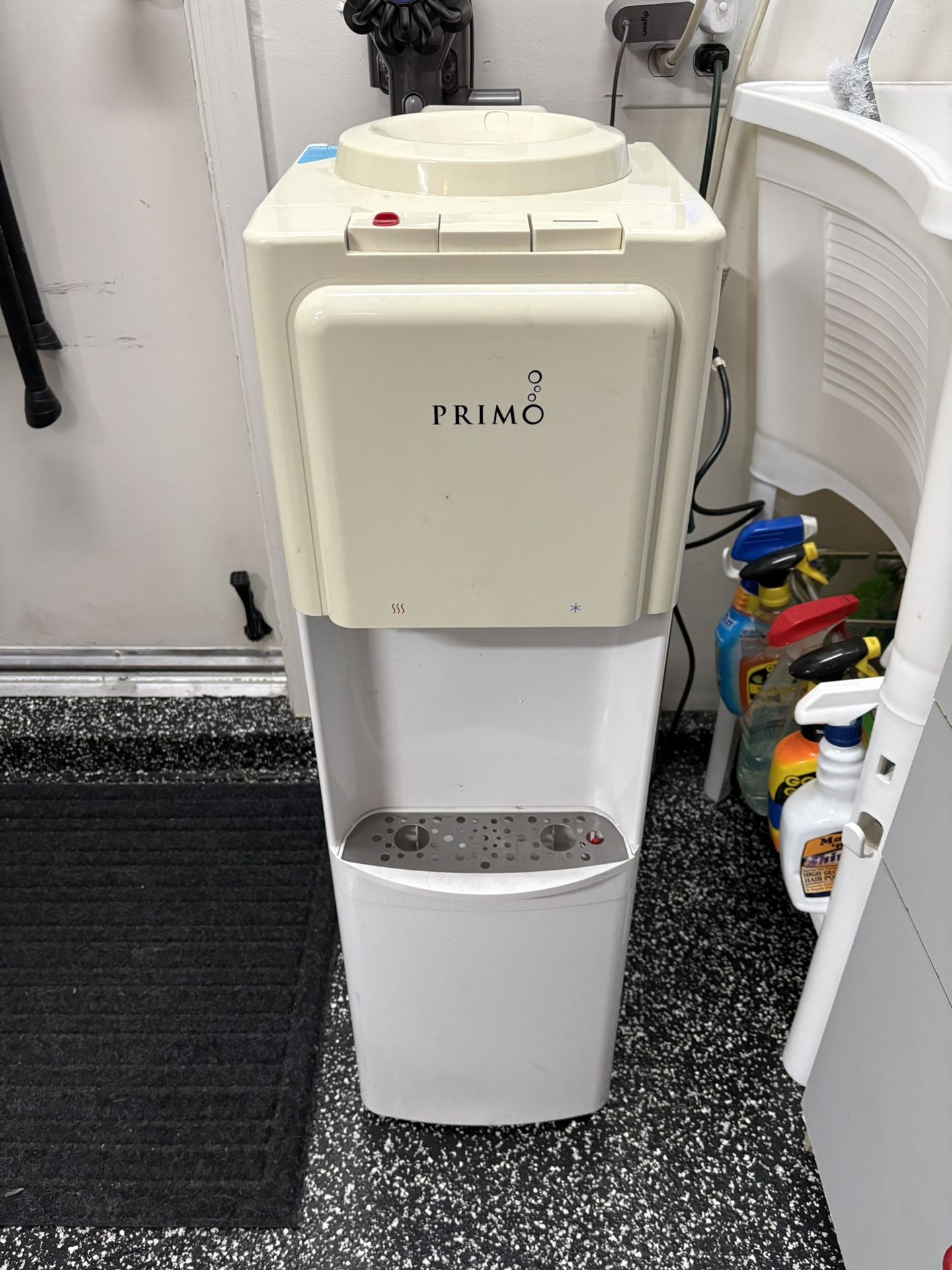 The PRIMO Model 601275 is a popular top-loading water dispenser that provides both hot and cold water, designed for 3 or 5-gallon jugs,