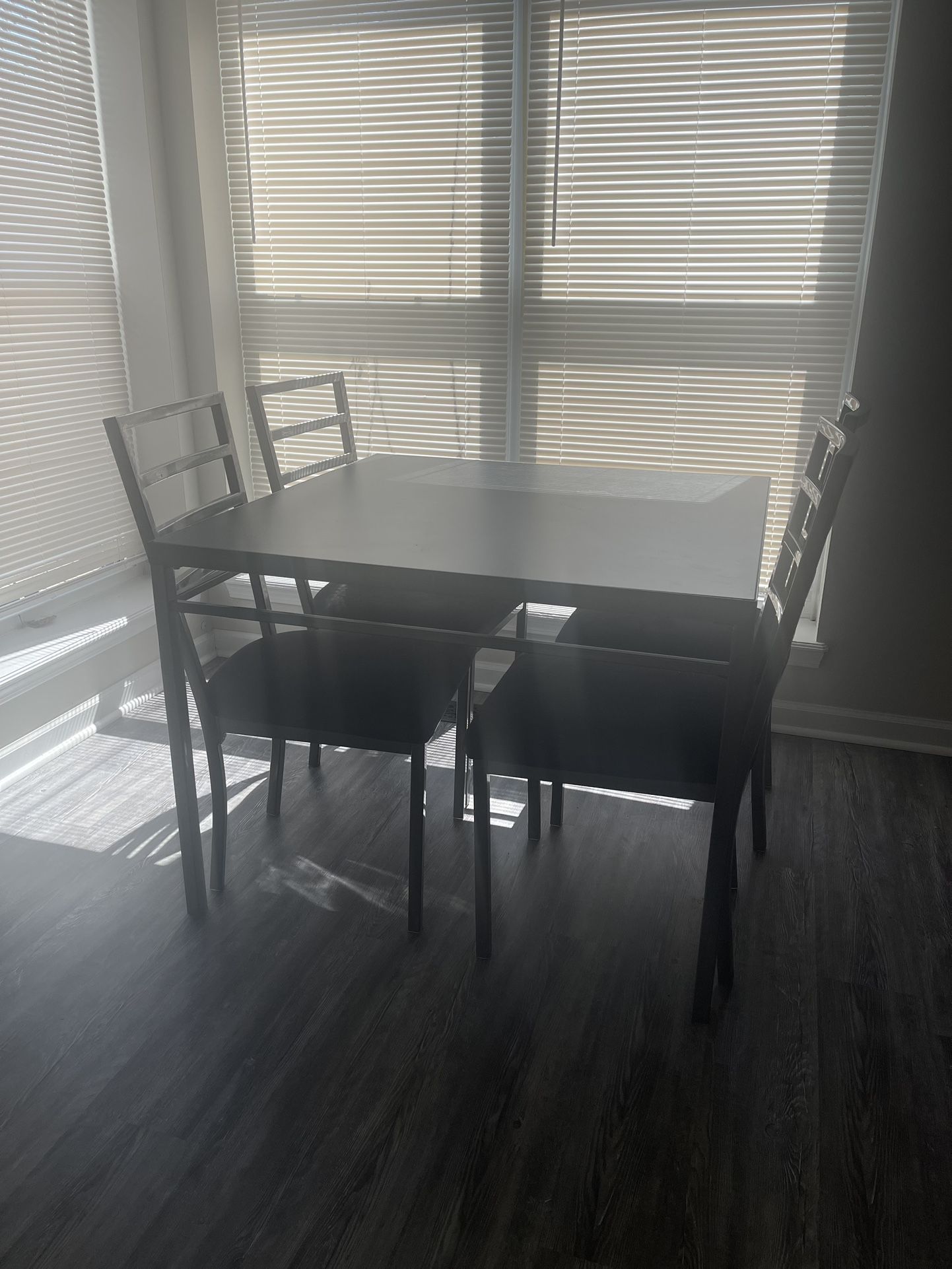 Black and silver four seater dining room table