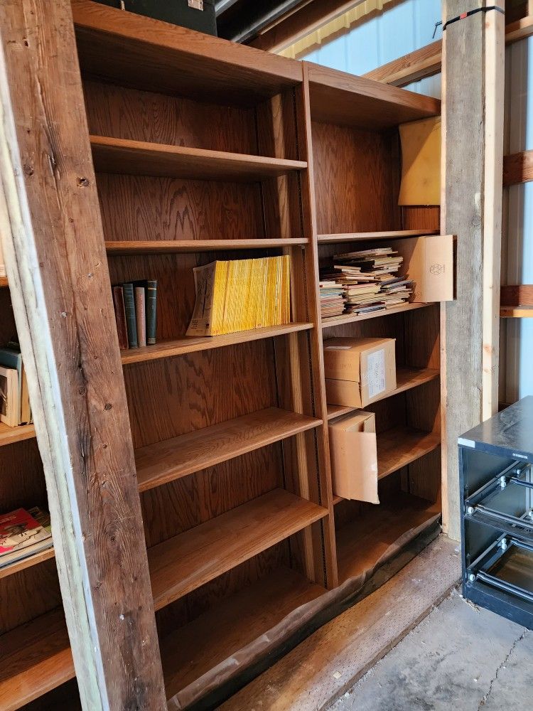 Large two-sided wooden public library shelves