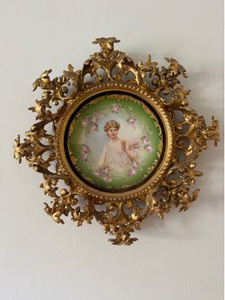 Limoges porcelain portrait plaque mounted in an ornate gilt (gold-finished) wall frame.  Here are the details I can make out:  * Porcelain: Limoges, F