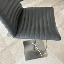 Two Gray Adjustable Bar Stools