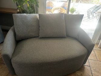 Oversized grey swivel chair