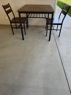 Dining table with two chairs