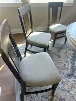 Dark Wood Dining Chairs with Gray Upholstered Seats
