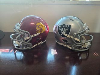 Las Vegas Raiders and USC Trojans Miniature Football Helmets - Displayed Like New