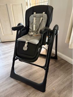 Brand new, open box. Never used high chair