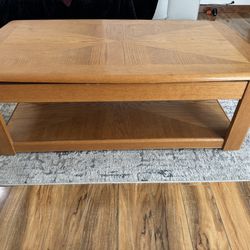 Living room table with adjustable top