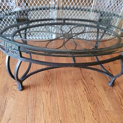Wrought iron with glass top oval coffee table