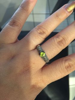 A 925 Sterling silver ring size 9 with marcasite and green ruby stone $18. Size 9