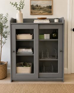 IKEA HAUGA Glass-Door Cabinet in Gray.