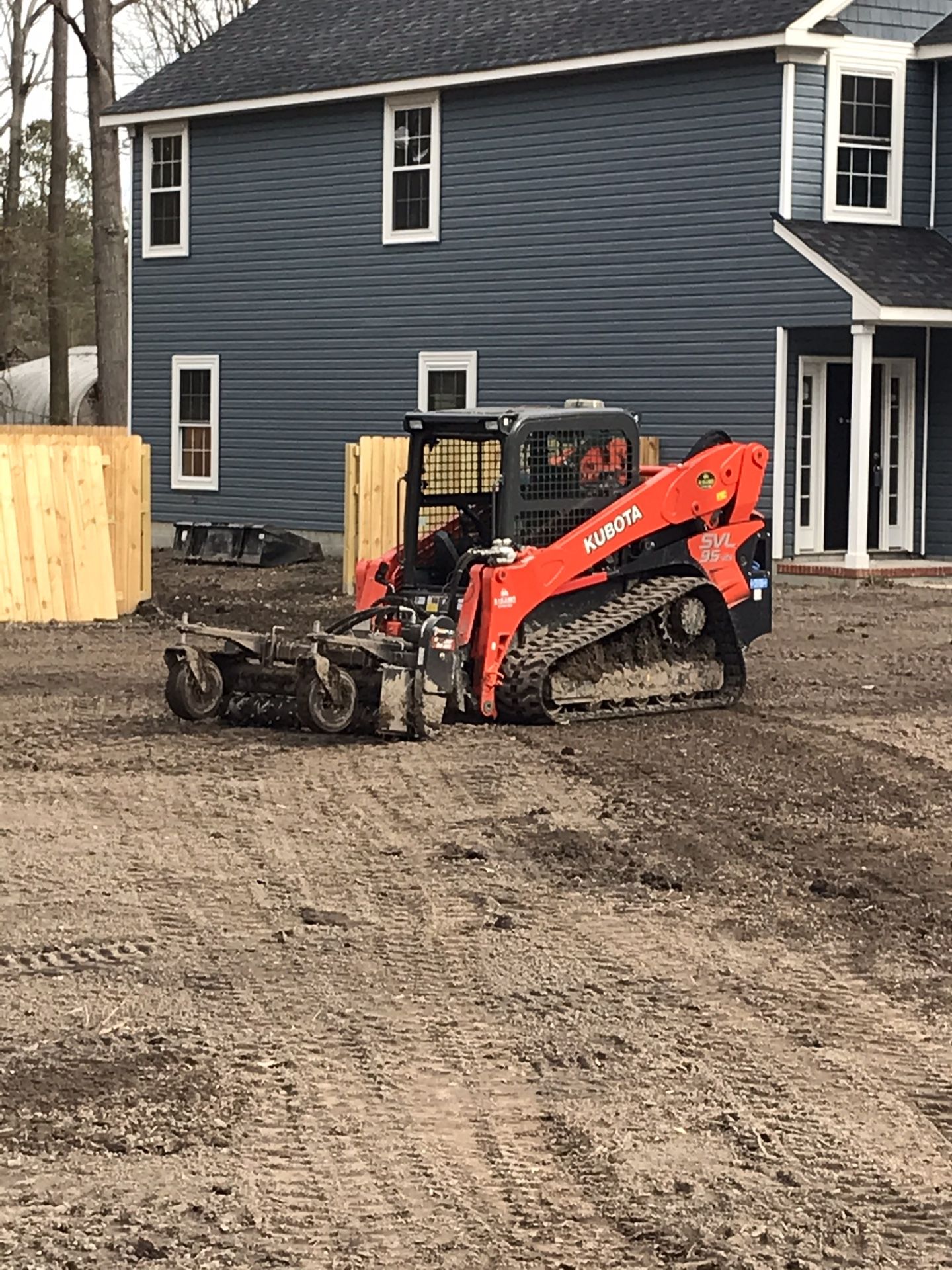 Skid steer, excavator, tractor and dump truck work