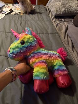 rainbow-striped plush unicorn