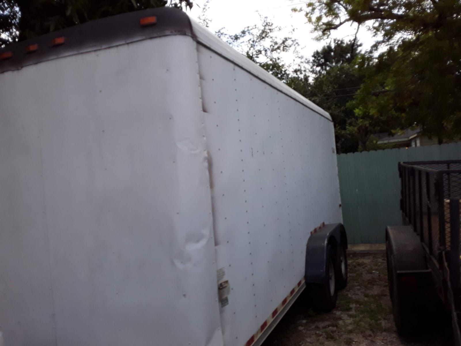 Enclosed trailer car hauler