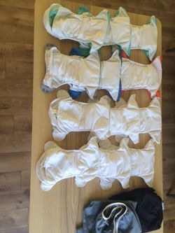 Never used Bum genius cloth diapers w/ pail liners