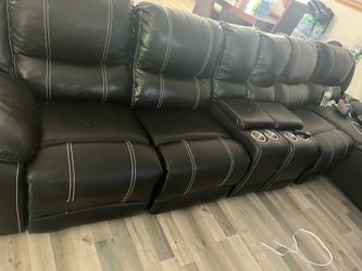 Black sectional couch with reclines