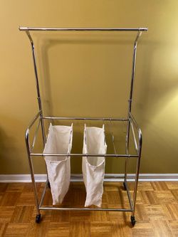 Laundry cart with clothes rack/ height adjustable /swirl wheels and two wheel locks/ 1 bag missing /See our pictures posted. Pick up in Lake Zurich.