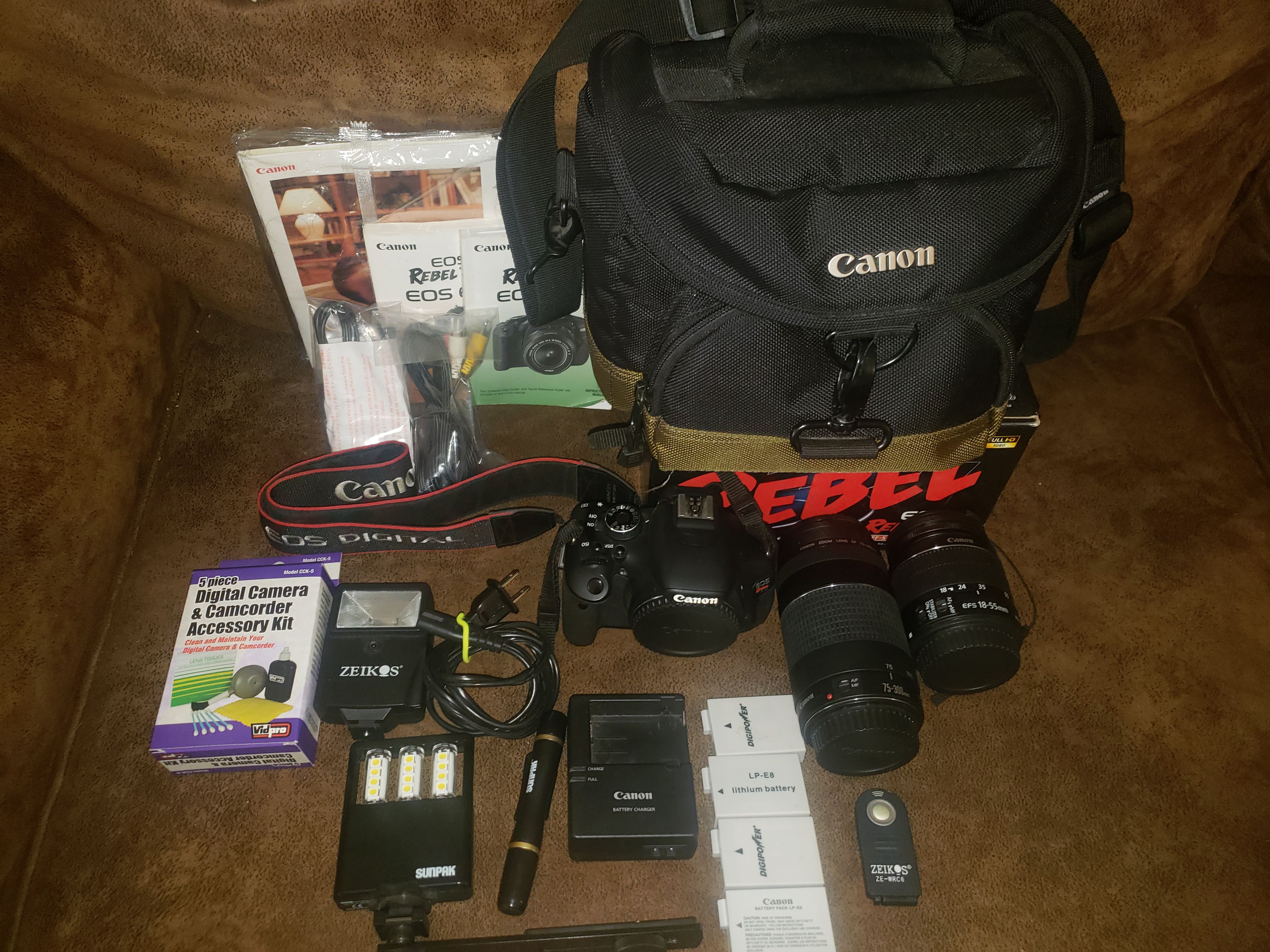 Canon rebel T3i bundle. 4 batteries, charger, 2 lenses and much much more. Everything in perfect condition