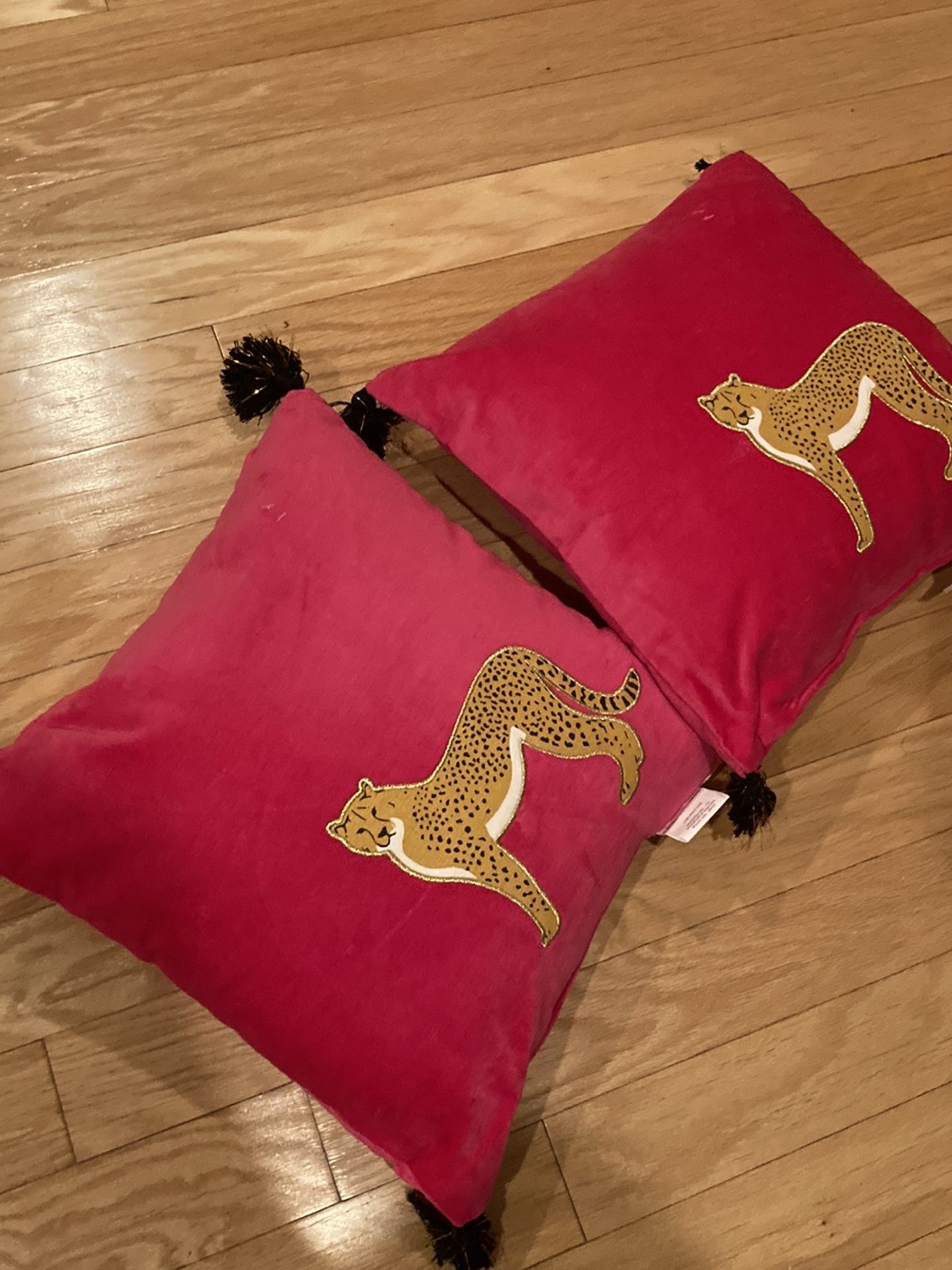 Two pink cheetah chinoiserie throw pillows