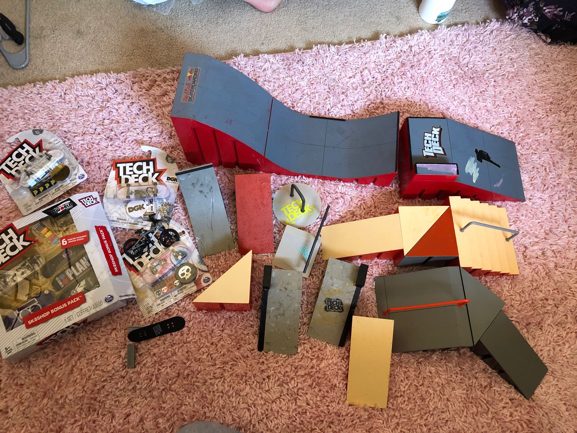 Tech deck lot ramps, skateboards,and a bmx bike