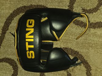 Sting head gear gold and black size M.