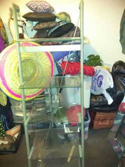 Big glass stand I used it for Nick nacks stand as ladder or straight up large beautiful mirror for living room or dining room both for 60 dollars
