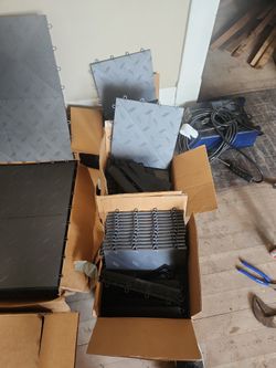 3 Boxes Of Large Snaplock Flooring Never Used And 3 Small Boxes Of The Same Never Used