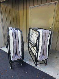 Folding bed with mattress.