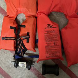 Life Jackets And Boat Trailer Rollers